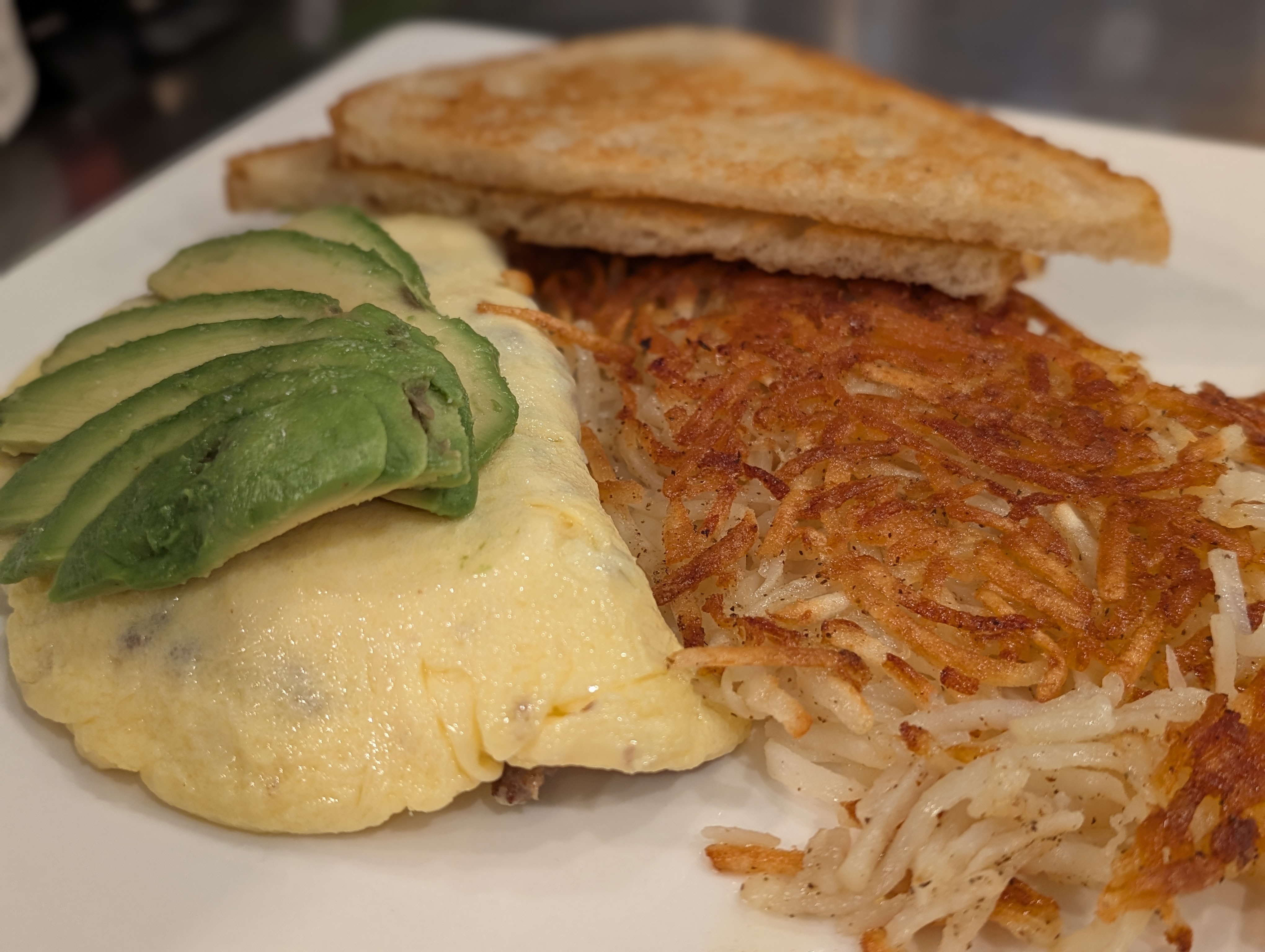 Omelet topped with avocado